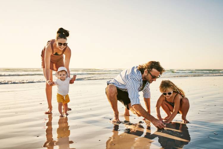 A family enjoys a day out on the beach