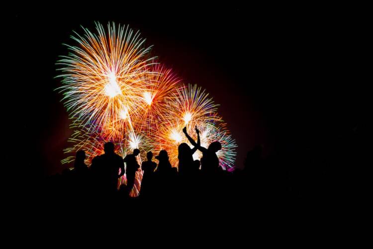 Fireworks with silhouette of people