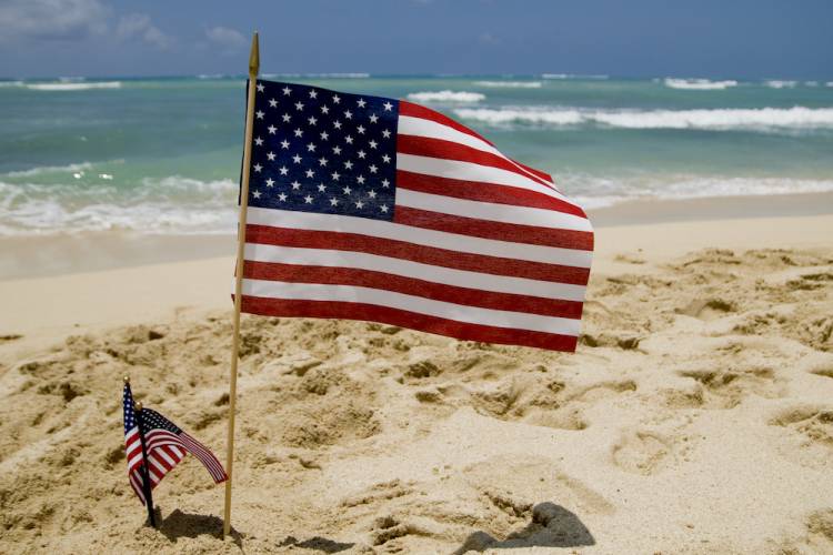 american flag on the beach