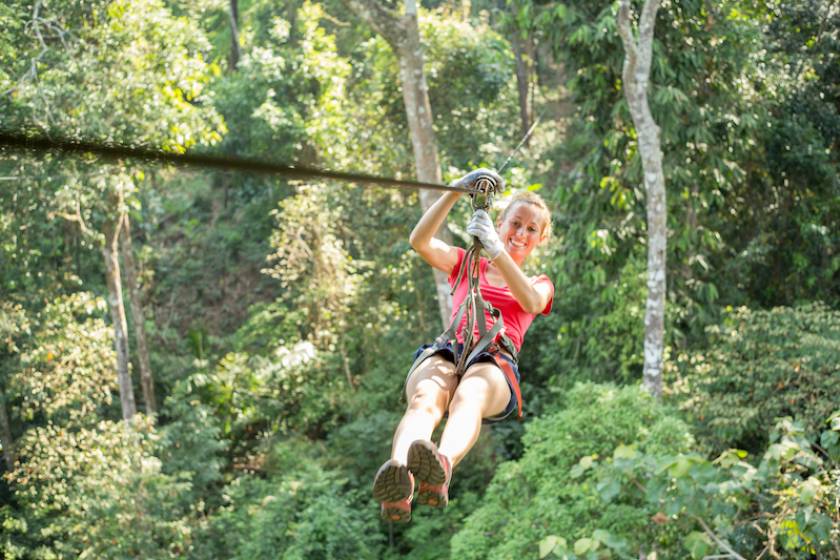 woman zipling in the forest